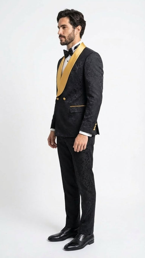 Men's black jacquard tuxedo with gold satin shawl collar. Fitted silhouette, textured black fabric, and gold button details. Includes sleek black pants.
