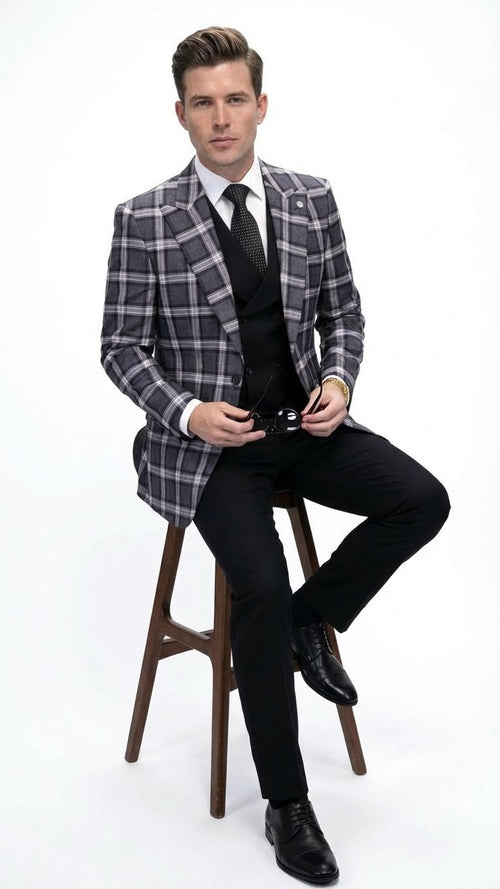 Men's charcoal & black plaid blazer. Big & tall fit, structured with peaked lapels & 2 buttons. Textured fabric with alternating dark/light squares. Tailored sleeves. Worn with black trousers.