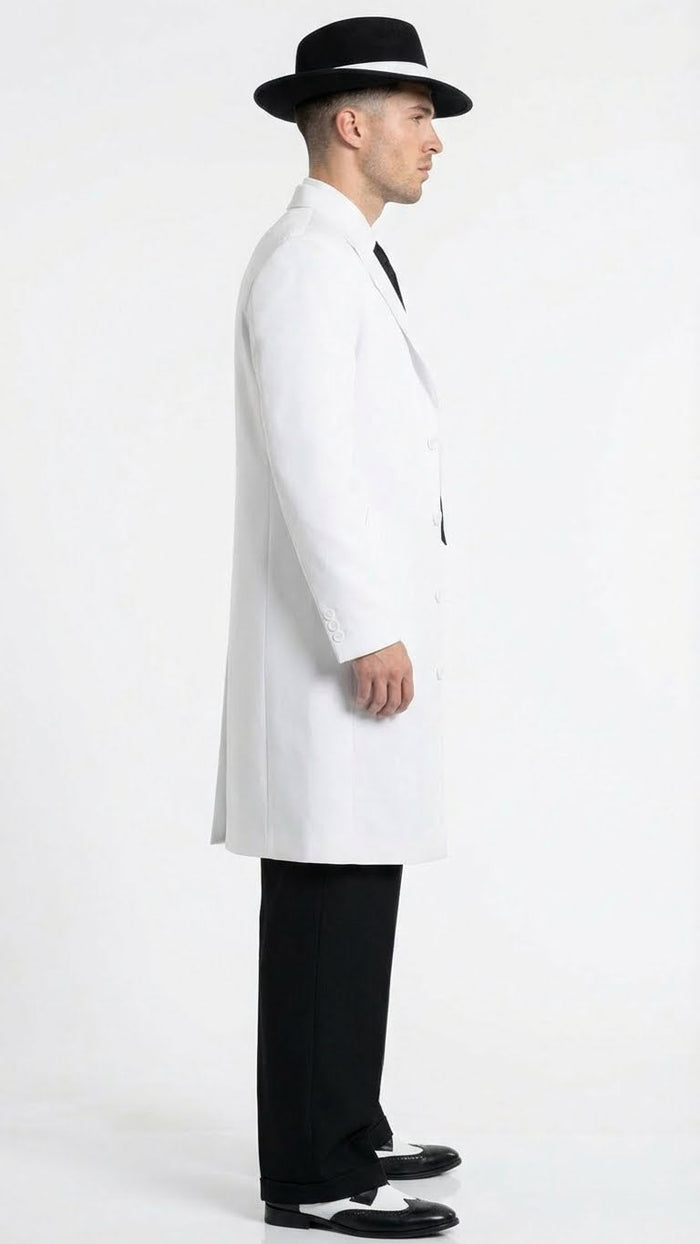 Men’s white zoot suit gangster style outfit features a long white jacket with a tailored cut, black dress pants, and black and white shoes. A black fedora completes the look.