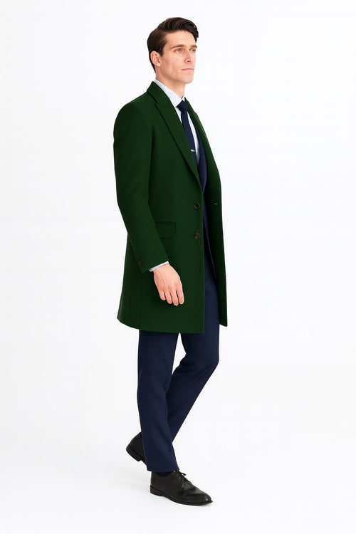 Dark green wool overcoat with classic tailored silhouette. Features: two-button front, side pockets, single-breasted design, and structured shoulders.
