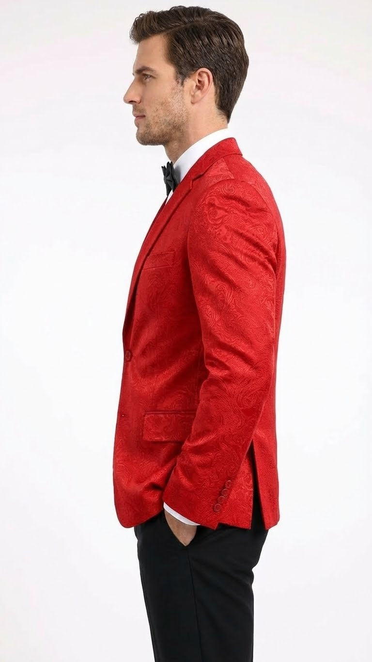 Red paisley velvet blazer. Fitted, single-breasted, notch lapels. Glossy finish highlights the pattern. Long sleeves, buttoned cuffs, and back side vent for comfort and style.
