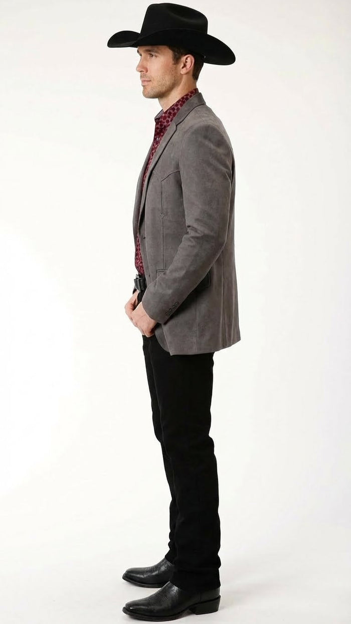 Men’s brown western faux suede blazer by Alberto Nardoni features a fitted silhouette with a notched lapel, two front pockets, and a soft texture. The color appears even and rich throughout the surface.
