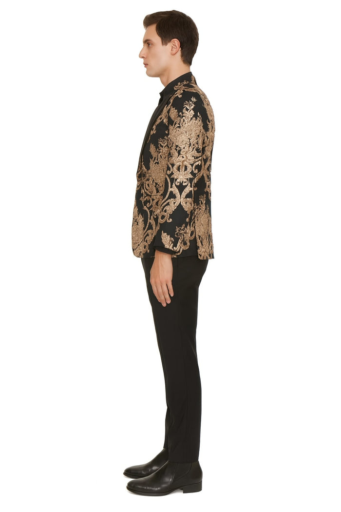 Black blazer with rose gold floral embroidery and structured shape. Paired with black pants. Features classic notch lapel and intricate gold detailing.
