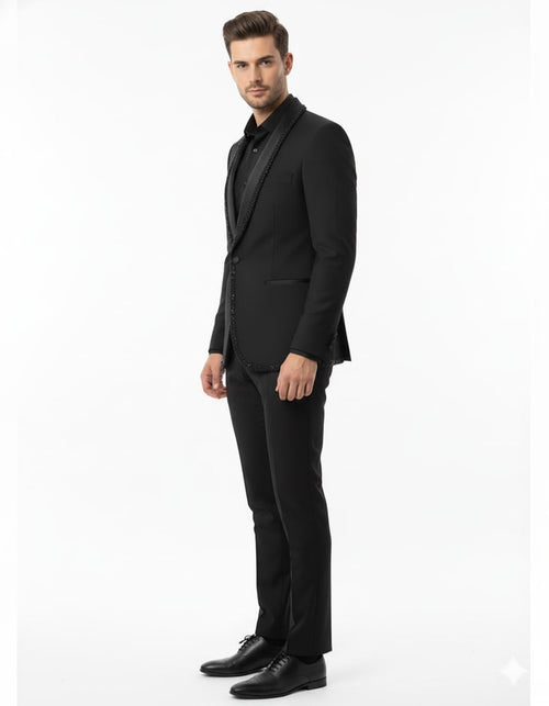 Men's classic black blazer with beaded lapel, perfect for formal events and parties. Features a tailored fit, single-breasted front, and two pockets. Paired with slim-fit black trousers for a complete, polished look.
