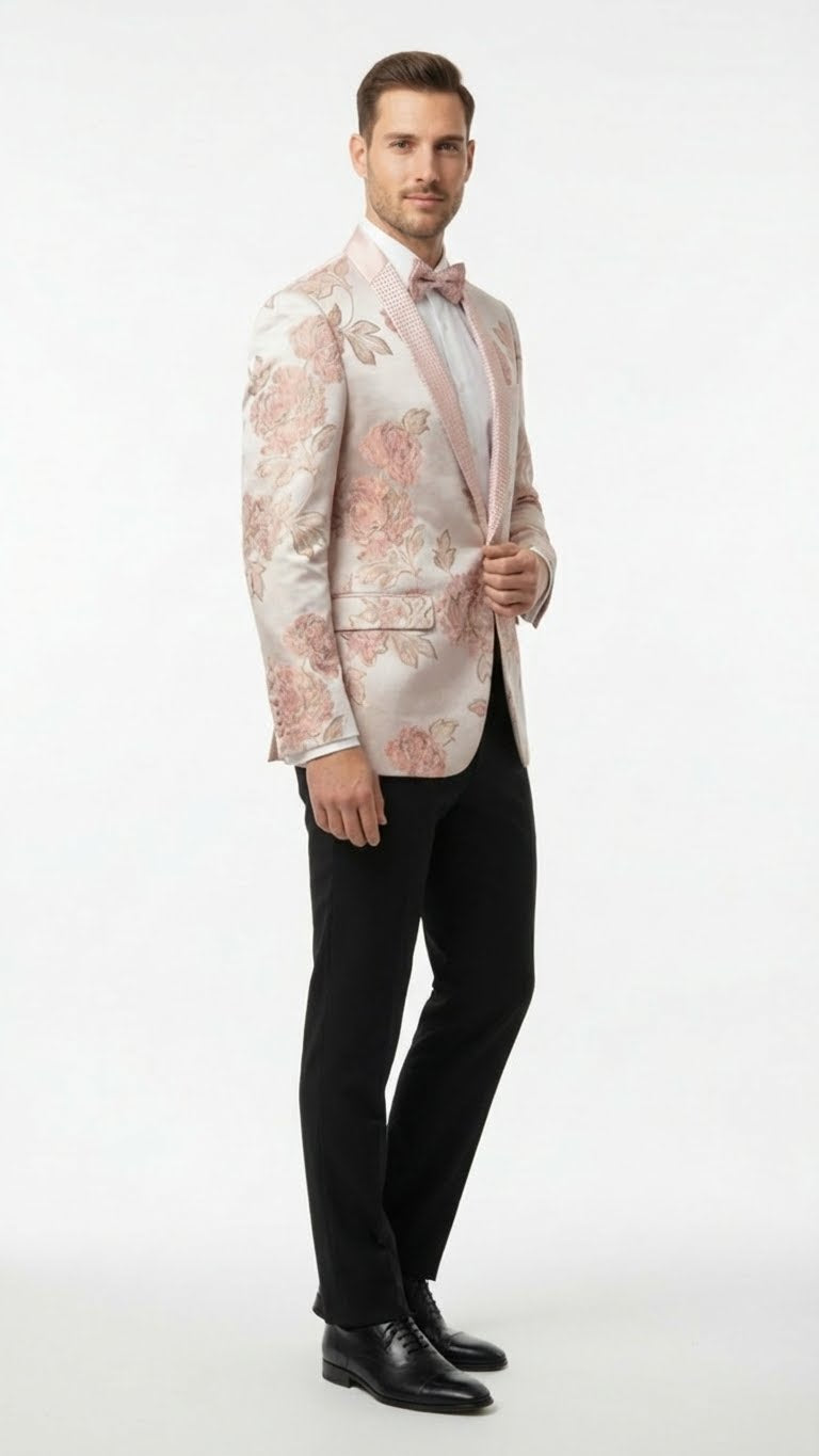 Men's pink floral jacquard blazer. Fitted, single-button closure, embellished shawl lapel, decorative cuffs, side pockets. Features floral pattern in pink shades. Worn with light shirt and bow tie.
