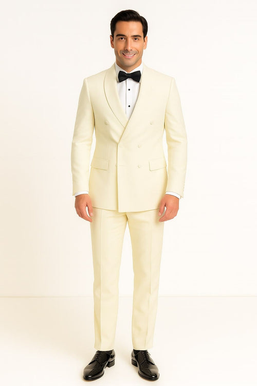 Men's off-white double-breasted tuxedo jacket. Shawl lapel, tailored fit, visible buttons, and two side pockets. Smooth, uniform fabric.
