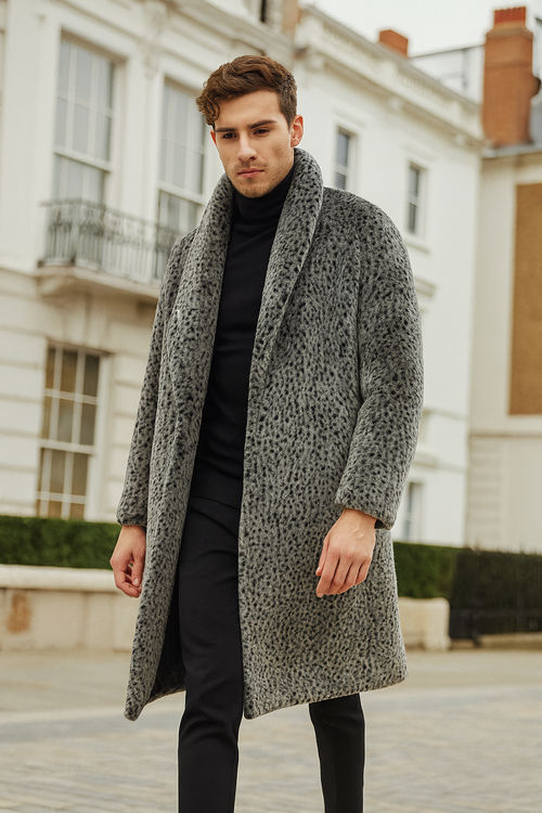 Men's luxury long grey faux fur coat with animal print, loose fit, and shawl collar. Features dark & light grey tones with a textured surface, falling below the hips. Designed for warmth.
