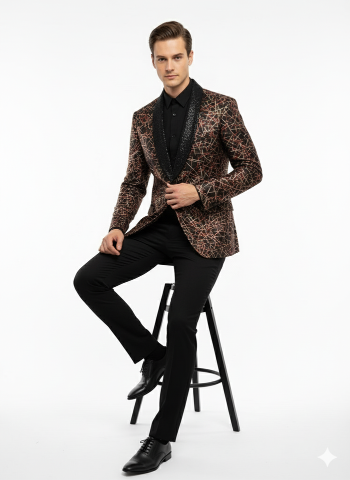 Men's black shiny designer blazer with red/gold spiderweb pattern. Black textured shawl collar. Fitted, long sleeves, glossy material.
