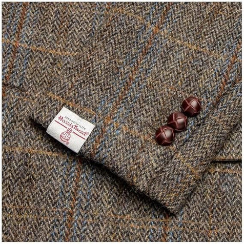 Brown Harris Tweed Blakemore blazer with checked pattern (blue, orange). Wool fabric, textured. Features three dark brown cuff buttons and a Harris Tweed label.
