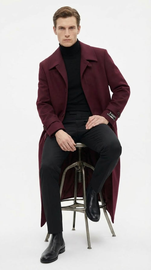 Alberto Nardoni men's burgundy overcoat. Full-length, straight silhouette with tailored fit. Notched collar, button-front, and long sleeves. Wool blend for warmth. Back extends below the knee.
