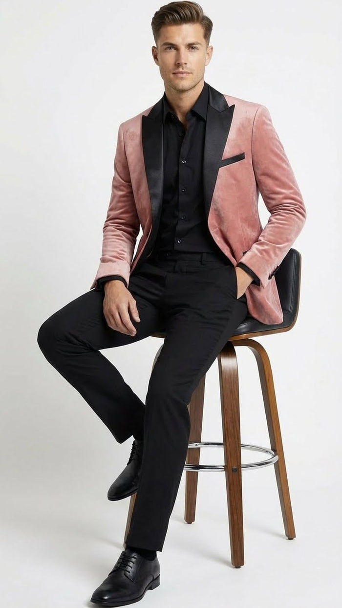 Men's dusty rose velvet blazer with black satin lapel. Fitted, peak lapels, single pocket. Plush velvet texture with a sleek satin detail.
