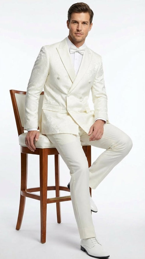 Ivory double-breasted tuxedo jacket with structured silhouette and textured pattern. Peak lapels, button closure. Matching ivory trousers complete the set.
