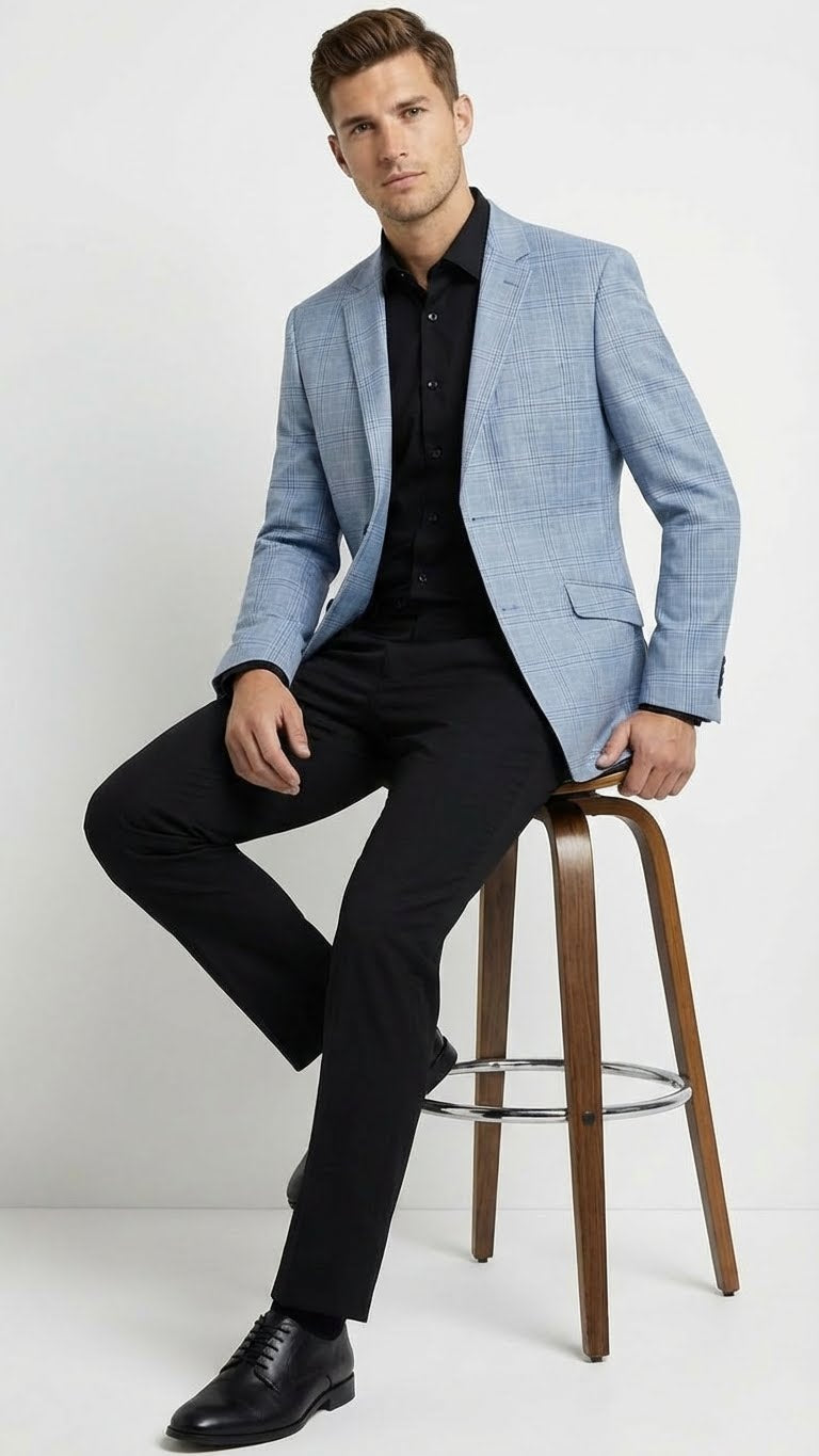 Men's light blue checkered blazer in big & tall sizes. Structured, tailored fit with notch lapel, two front pockets. Smooth textile with light blue and white check pattern. Likely unlined for comfort.
