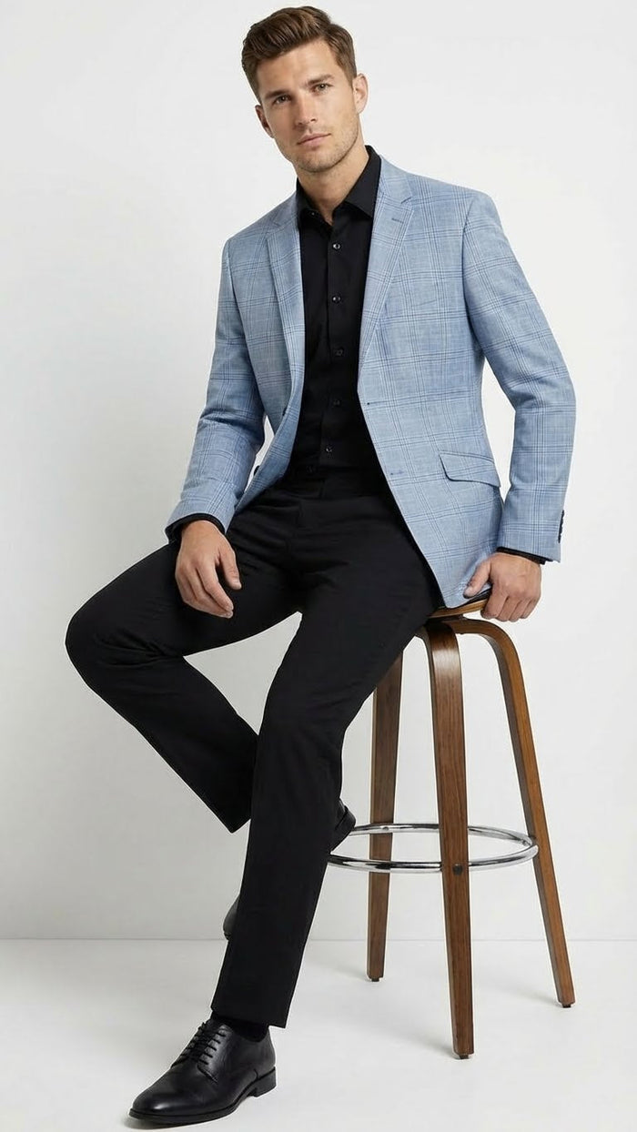 Men's light blue checkered blazer in big & tall sizes. Structured, tailored fit with notch lapel, two front pockets. Smooth textile with light blue and white check pattern. Likely unlined for comfort.
