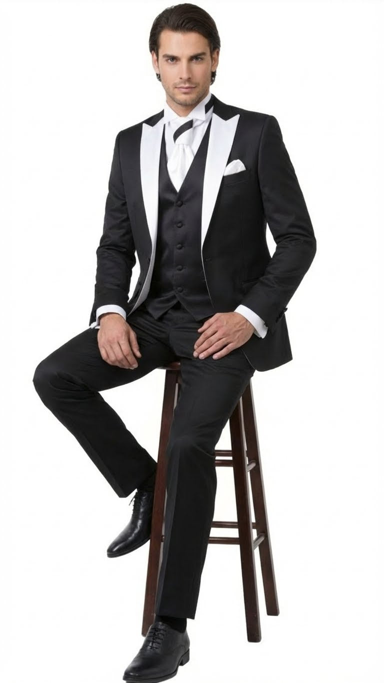 Classic men's black and white prom tuxedo: black jacket with white lapels, black vest, matching trousers. Includes white bow tie and pocket square. Tailored fit, smooth fabric.

