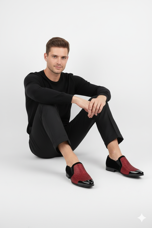 Men's red glitter tuxedo loafers: slip-on design with a shiny, glitter-covered upper and black patent toe. Perfect for a bold, formal look.
