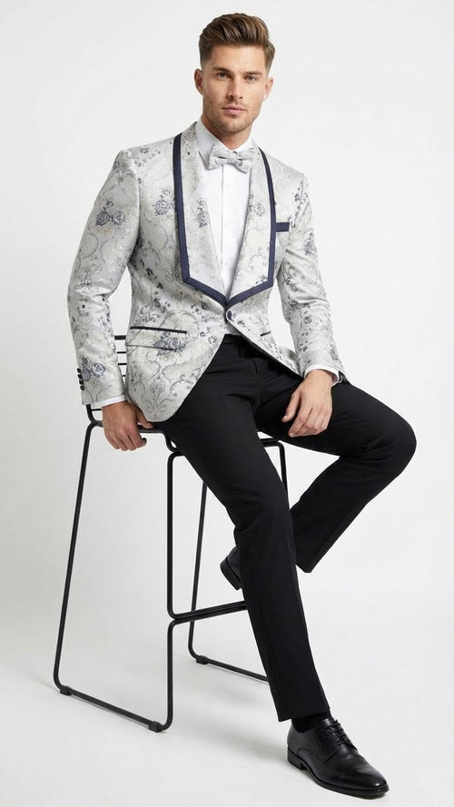 Men's floral jacquard blazer: white with navy shawl lapel. Features a structured fit and floral pattern on a light background.
