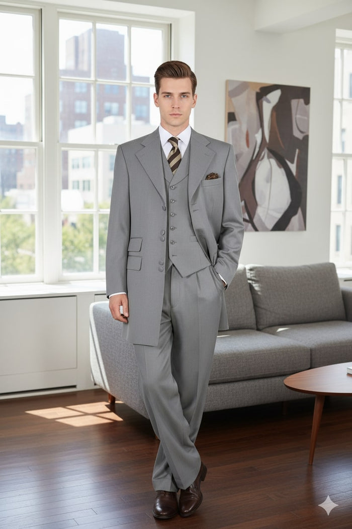 Light gray three-piece suit: long jacket with wide lapels & front pockets, vest with 3 buttons & notched neckline, and straight-leg trousers. Smooth, tailored fabric. Classic design.
