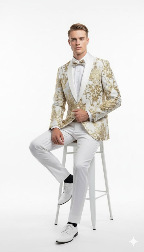 Men's white tuxedo jacket with gold floral pattern, satin lapel, and single-button closure. Tailored fit complements matching white trousers and shoes for a structured look.
