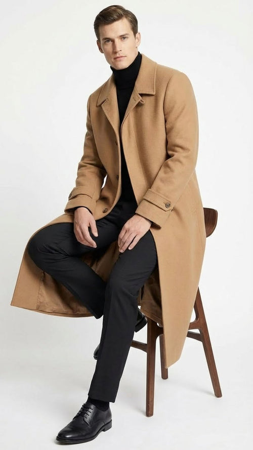 Alberto Nardoni men's camel overcoat. Full-length, straight tailored cut, below-the-knee. Soft camel fabric, classic collar, button closure, buttoned cuffs. Unlined, structured silhouette.

