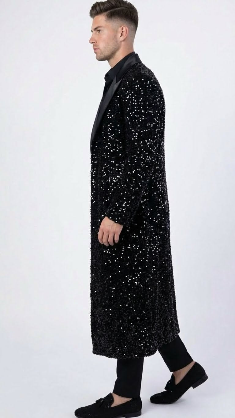 Black sequin men's long coat with a fitted shape and satin shawl lapel. Covered in shiny sequins, the mid-calf coat offers a textured, soft appearance.

