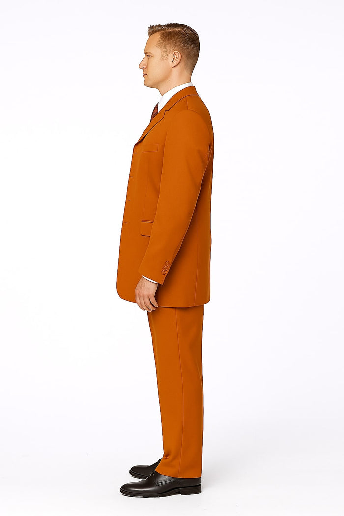 Men's rust three-piece suit by Alberto Nardoni. Features a single-breasted blazer, matching trousers, and waistcoat. Smooth rust fabric, loose fit, visible stitching, and sleek design.

