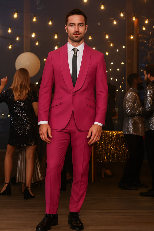 Hot pink men's tuxedo set: slim-fit jacket with shawl lapel, single-button closure, and two pockets. Tailored pants match. Smooth, consistent fabric.
