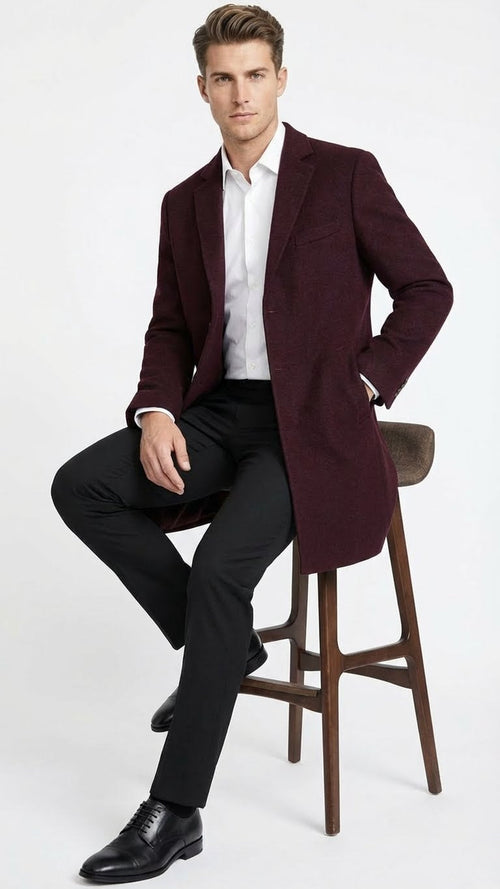 Alberto Nardoni men's burgundy mid-length overcoat. Tailored fit, straight silhouette, textured fabric. Notched lapel, single-breasted, two pockets. Sleek, simple design.

