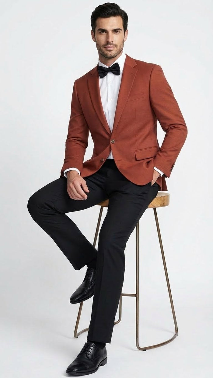 Alberto Nardoni men's rust brick blazer. Tailored fit, structured shoulders, single-button closure, notch lapel. Textured, soft yet durable fabric. Two front pockets, chest pocket. Long, slightly tapered sleeves.

