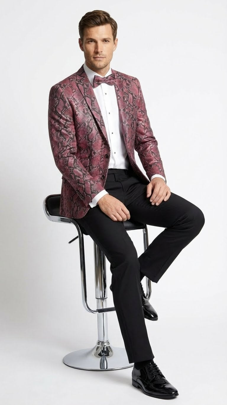 Alberto Nardoni men's blazer. Burgundy and black snakeskin print, tailored fit, notched lapel, long sleeves. Unstructured, modern silhouette. Worn with white shirt, black trousers.
