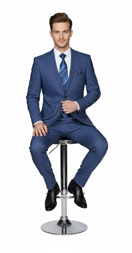 Indigo navy blue men's suit. Two-piece, tailored fit with cobalt blue and subtle windowpane check. Single-breasted jacket, notched lapels, straight-cut pants. Includes shirt & striped tie.
