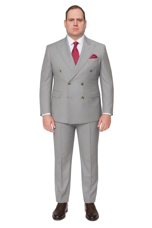 Men's light grey double-breasted suit with gold buttons, tailored fit, and subtle sheen. Includes matching trousers. Paired with a white shirt, red polka dot tie, and pocket square.
