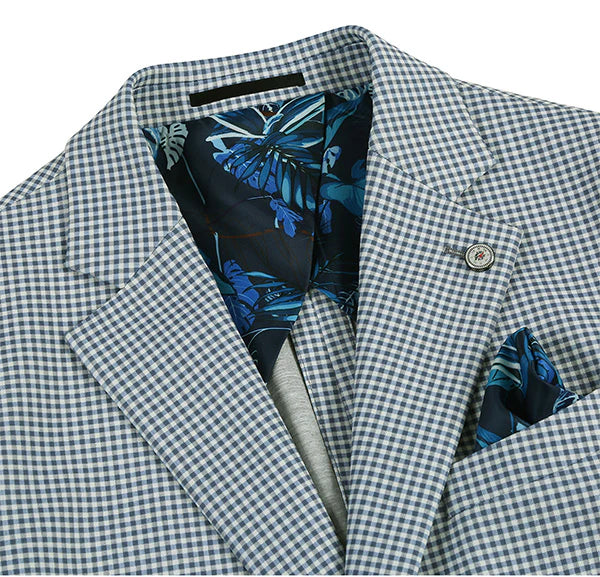 Sage blue check blazer. Slim fit, boxy shape, structured lapel. Subtle blue/white check pattern. Floral lining. Single button closure, pocket square detail.
