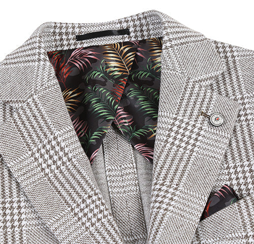 Slim fit, half-canvas plaid gray blazer. Notch lapel, single-button closure. Light/dark gray plaid exterior. Contrasting dark interior with colorful leaf pattern. Chest pocket with handkerchief.
