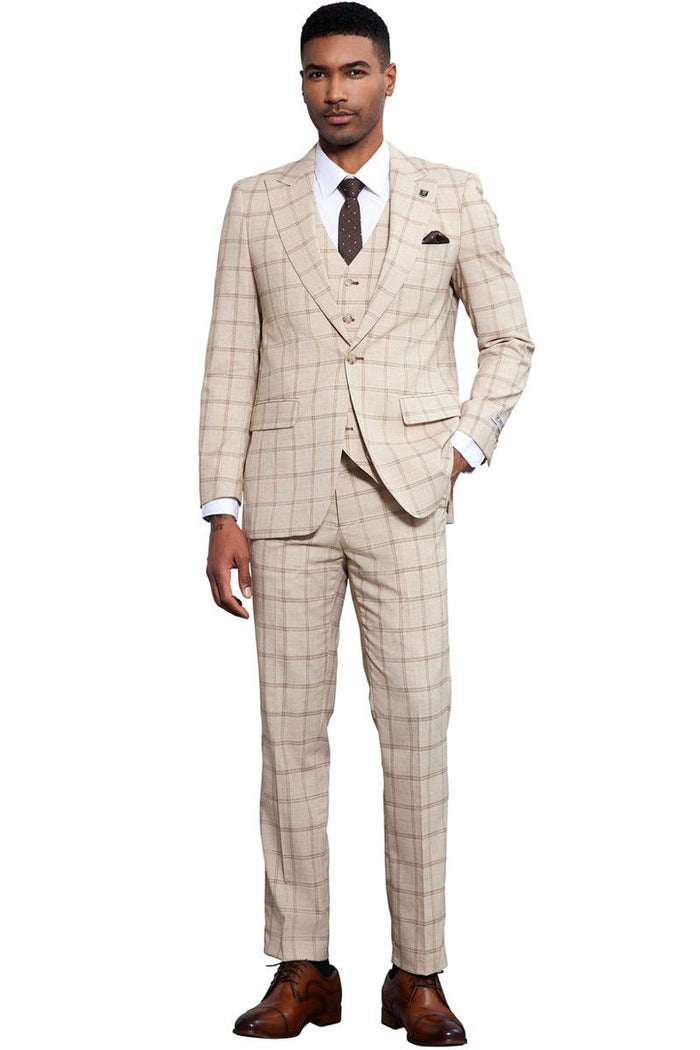Tan windowpane plaid suit by Stacy Adams. Men's tailored fit with a peak lapel, single-button closure, and matching vest. Features straight-leg trousers. Classic look with a tan and brown color scheme.
