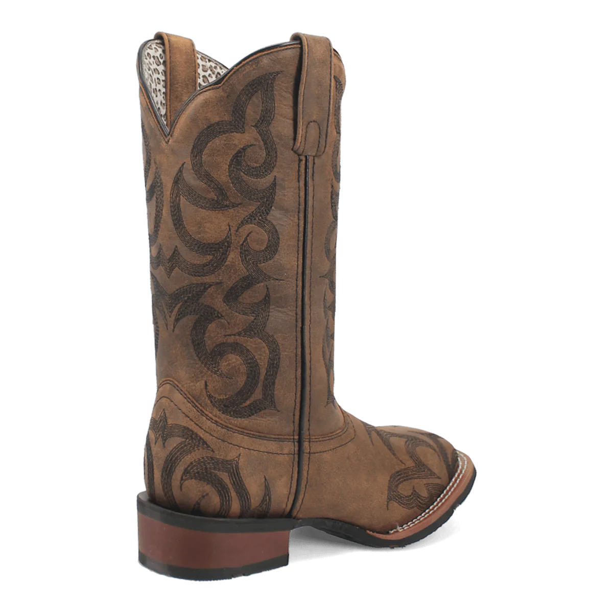 Laredo Sariah women's boot. Tall tan leather shaft with pointed toe, dark brown scrollwork. Stacked heel, pull tab, and contrasting fabric lining.
