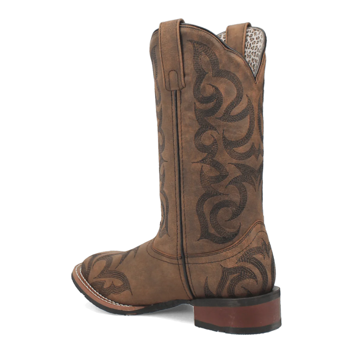 Laredo Sariah boot: Tall, rounded brown leather shaft. Intricate black stitching, pointed toe, and leather sole with a low heel. Features animal print lining.
