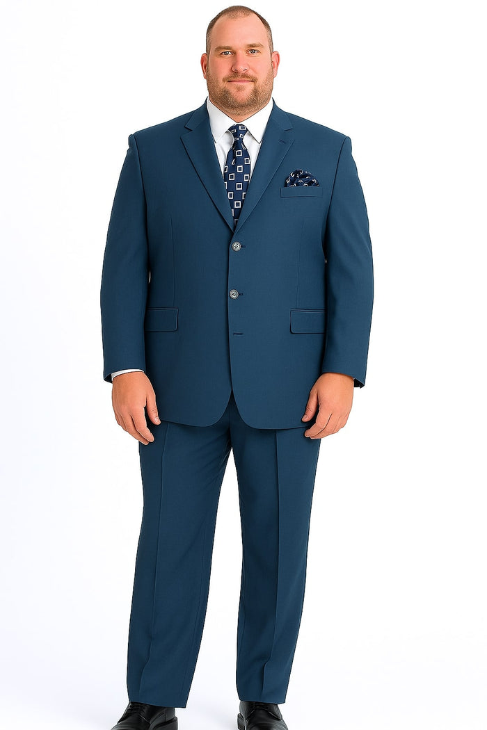 Steel blue, three-button classic suit. Structured blazer with two front pockets and matching trousers. Smooth fabric, no patterns.
