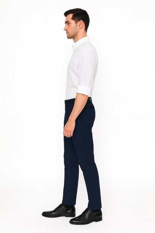 Men's white linen button-down shirt. Long sleeves, rollable to elbow. Classic collar, button closure. Lightweight, smooth fabric with tailored fit to waist. Versatile style.
