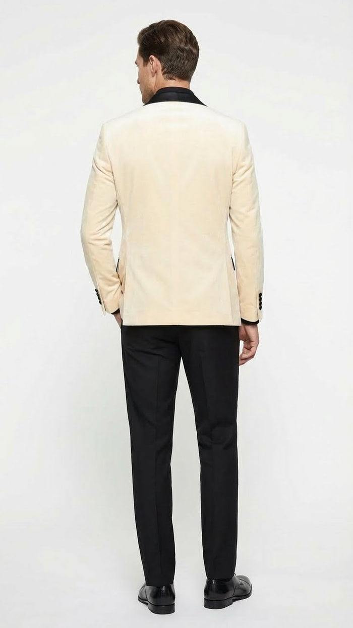 Men's ivory velvet dinner jacket with black satin lapel, tailored fit, and long sleeves. Includes black pants. Classic and elegant.
