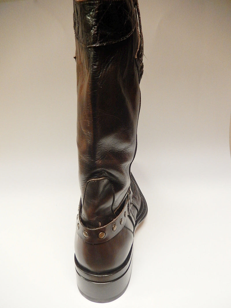Mauri chocolate alligator knee boots 44238. Tall, sleek, rounded toe, raised heel. Dark brown glossy leather. Ankle strap with metallic studs. Subtle back stitching details.