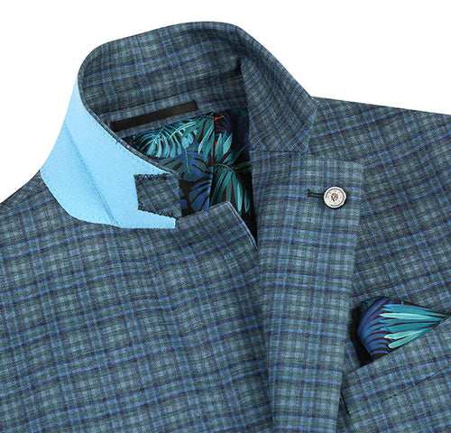 Green-blue check slim fit blazer with light blue collar accent. Tropical leaf lining, decorative pocket square. Structured form, precise patterns. Half canvas construction.
