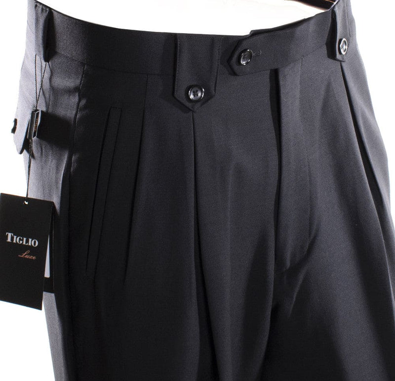 Tiglio Luxe black wide-leg wool dress pants. High-waisted with two-button closure and side pleats. Crafted from solid black wool.
