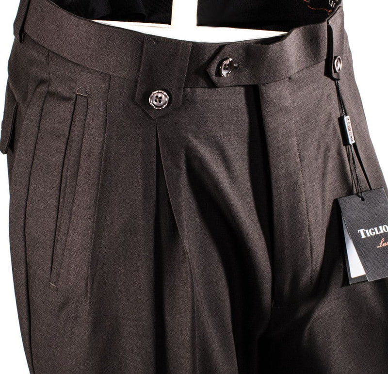 Tiglio Luxe brown wide-leg wool dress pants. Smooth texture, double pleats, flat front. Two-button waistband, belt loops. Pure wool.
