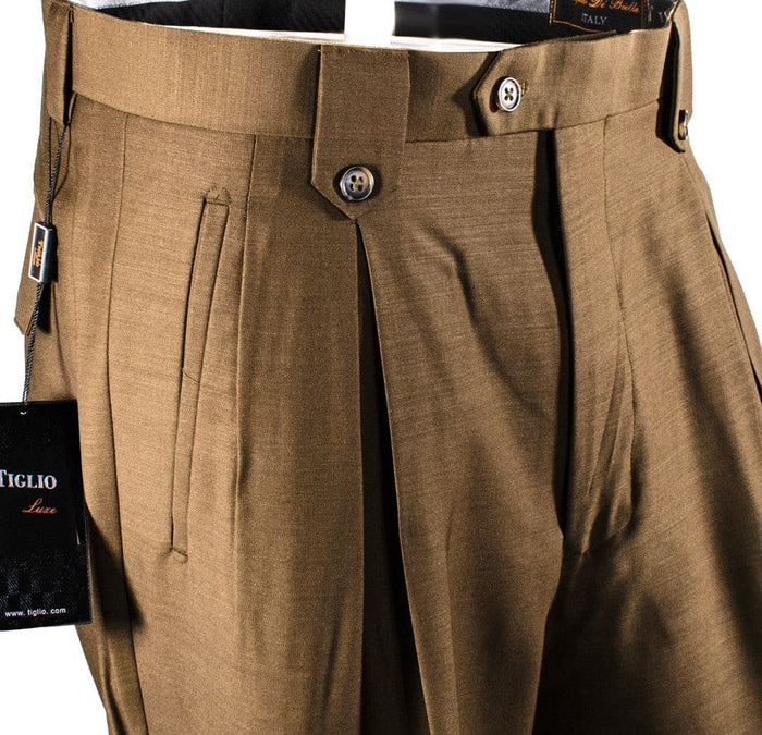 Tiglio Luxe brown wool wide-leg dress pants. High-waisted with pleats, smooth fabric, and button closure. Features twin side pockets.
