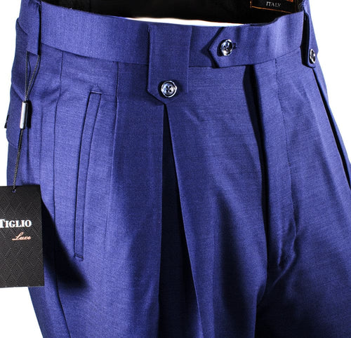 Tiglio Luxe French Blue wool wide-leg dress pants. Smooth texture, striking blue. Two front pleats, double-button waistband for structured shape.
