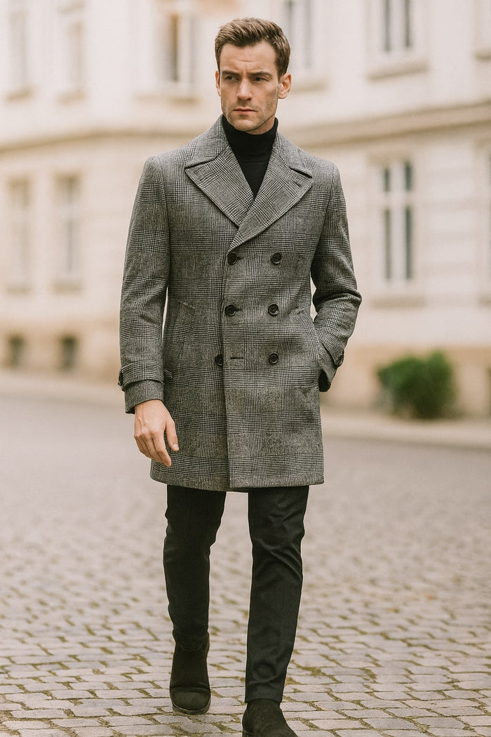 Men's grey plaid double-breasted overcoat with black faux fur collar. Tailored fit, textured fabric, visible buttons. Long sleeves with flared cuffs, mid-thigh length.
