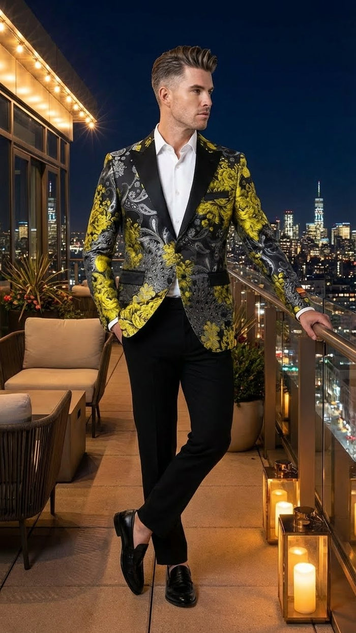 Yellow tuxedo jacket with black & gold floral pattern by Alberto Nardoni. Fitted silhouette, black lapel & pockets. Intricate floral motifs on dark background.
