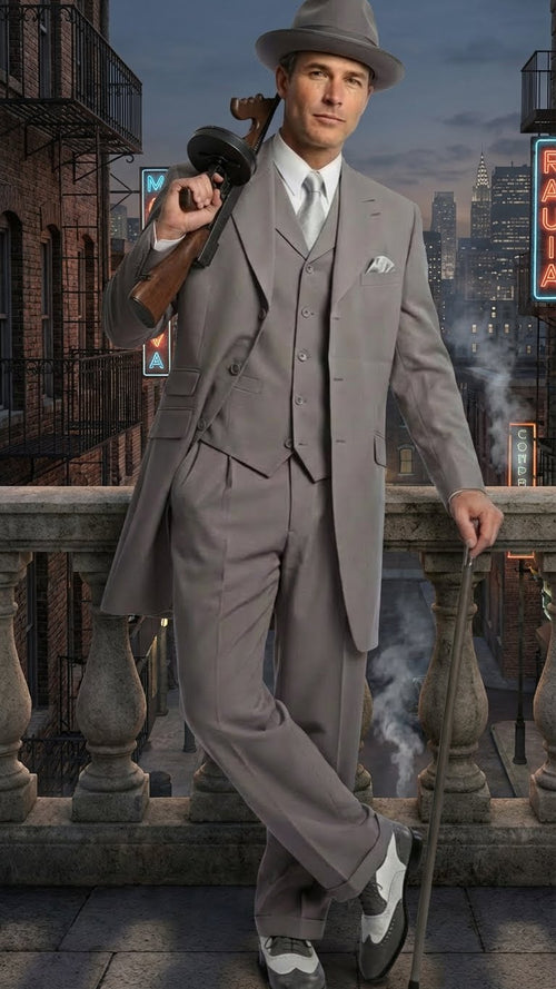 Men's gray zoot suit: fitted jacket (single-breasted, wide lapels), high-waisted, relaxed pants. Includes a matching gray fedora & two-toned gray/white shoes (rounded toe, low profile).
