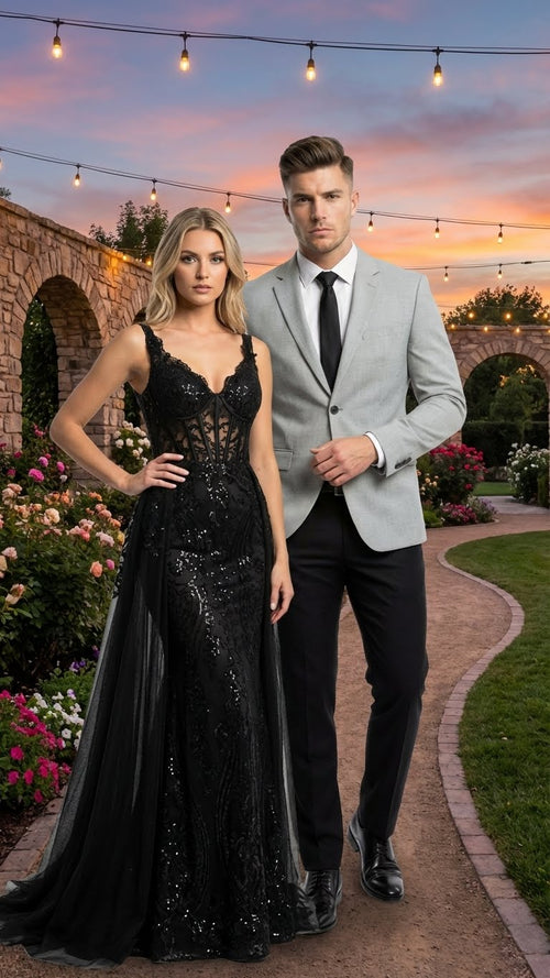 Men's light grey slim fit blazer. Tailored shape, smooth fabric, single-button closure. Paired with black pants for a coordinated look.
